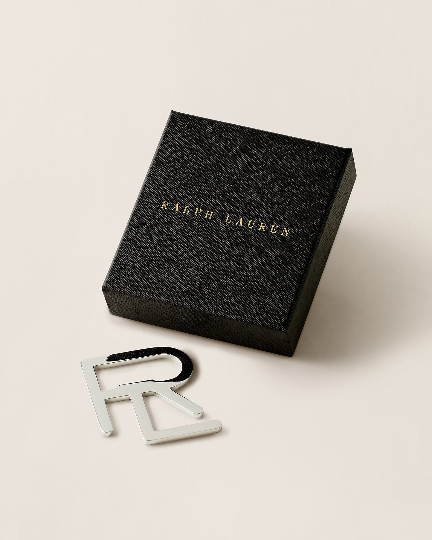 Décapsuleur à monogramme RL superposé